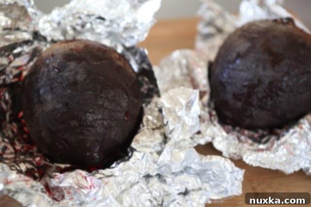 Freshly roasted beets, still warm from the oven, show their vibrant color