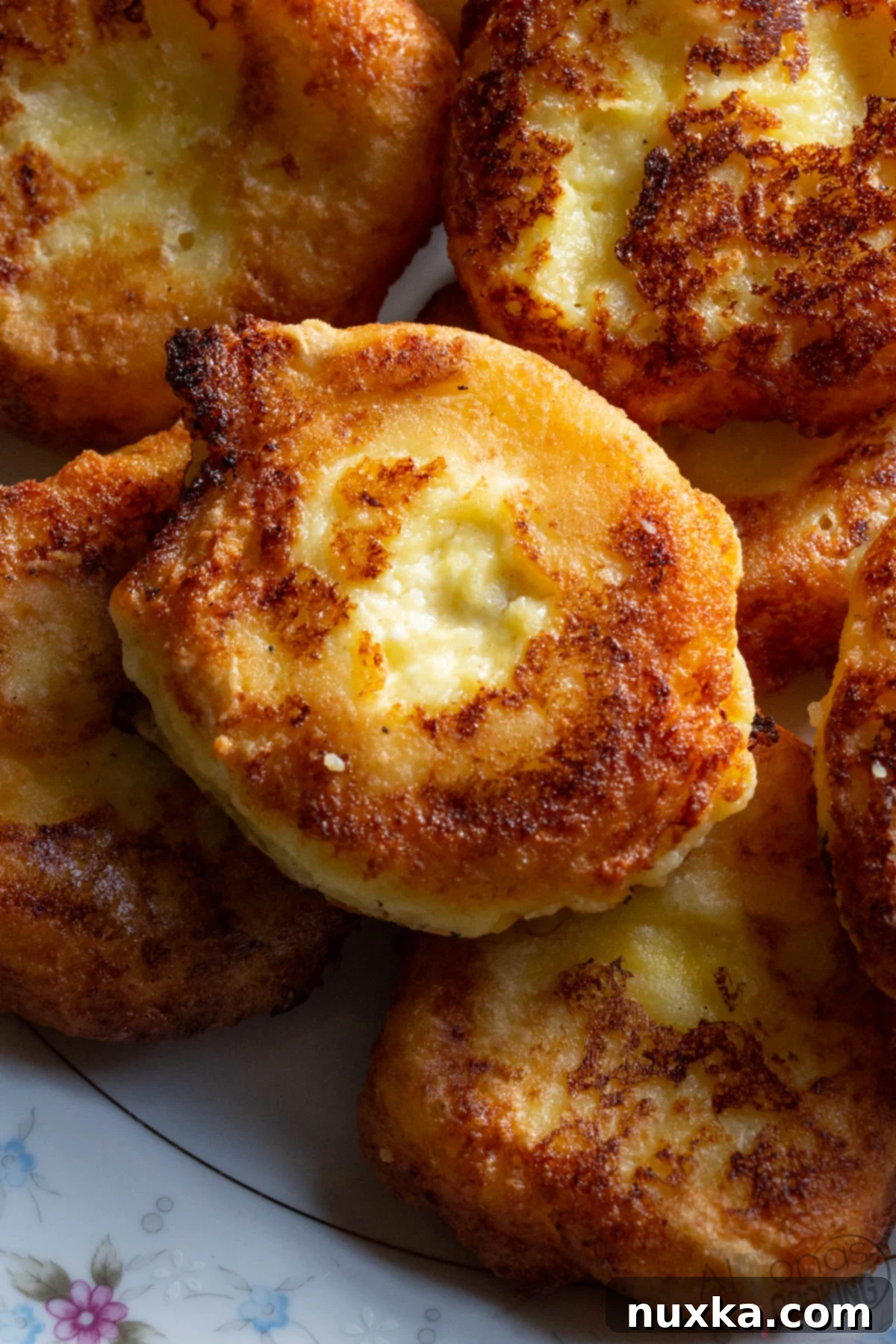 Russian Syrniki made with small curd cheese, flour, eggs, salt, and sugar. 