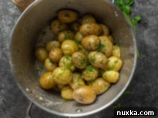 boiled potatoes garnished with dill and parsley