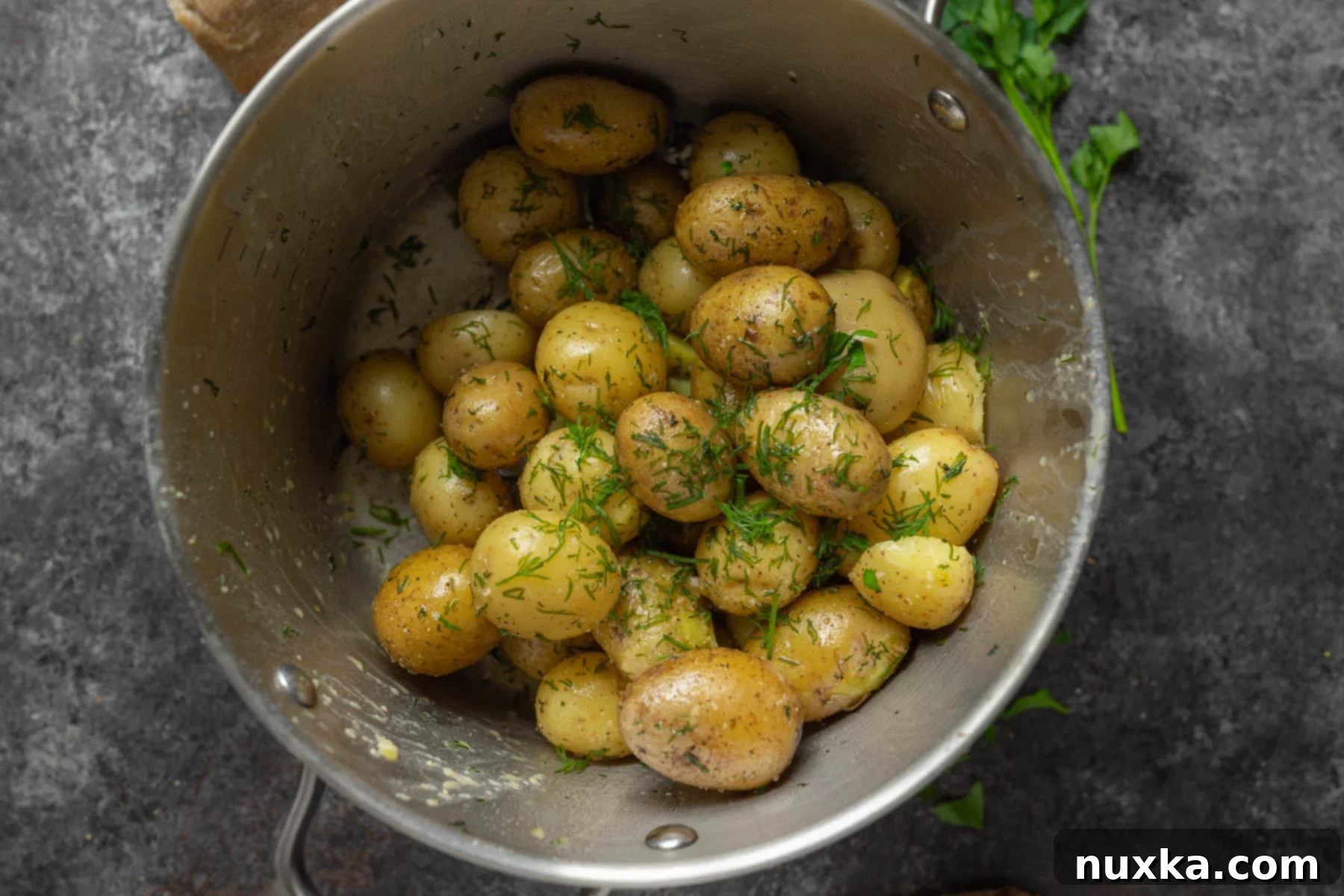 boiled potatoes garnished with dill and parsley 