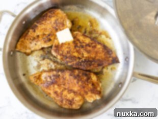 Pan searing chicken breasts in butter and olive oil for Cajun chicken pasta