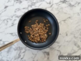 Toasting walnuts in a skillet