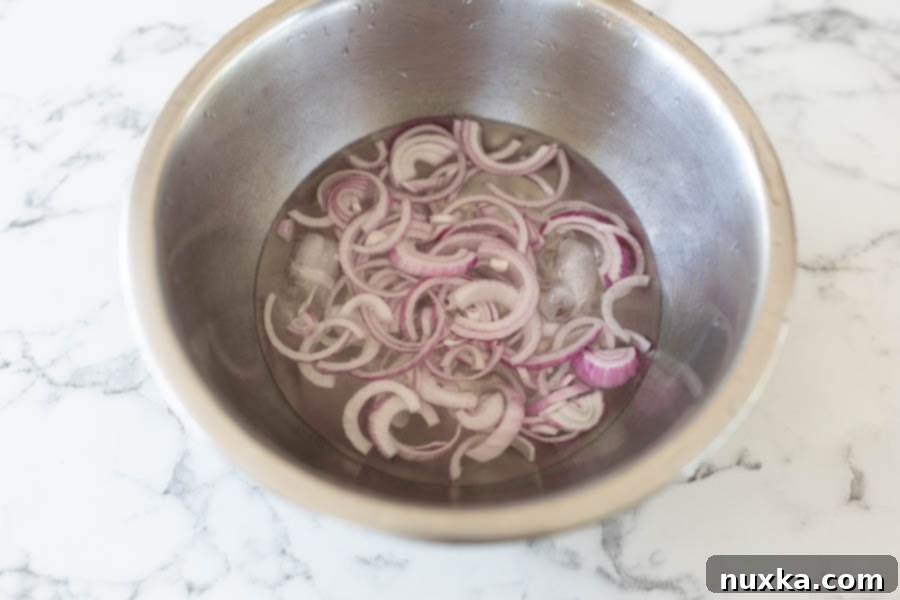 soaking onions in cold water to reduce any harsh aftertaste 