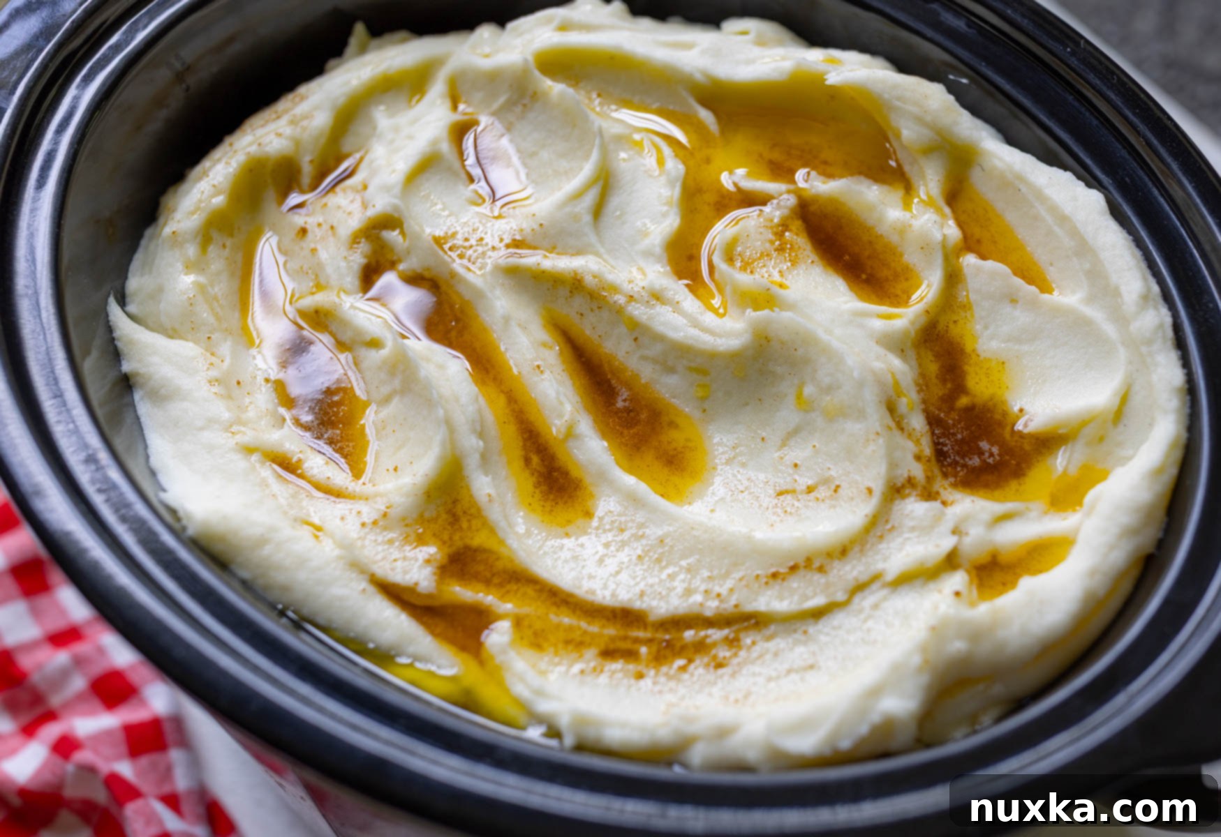 A large pot filled with creamy brown butter mashed potatoes, ready to be served.