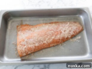 curing salmon wrapped in plastic wrap