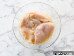 marinating chicken breasts in Italian dressing for Parmesan crusted chicken