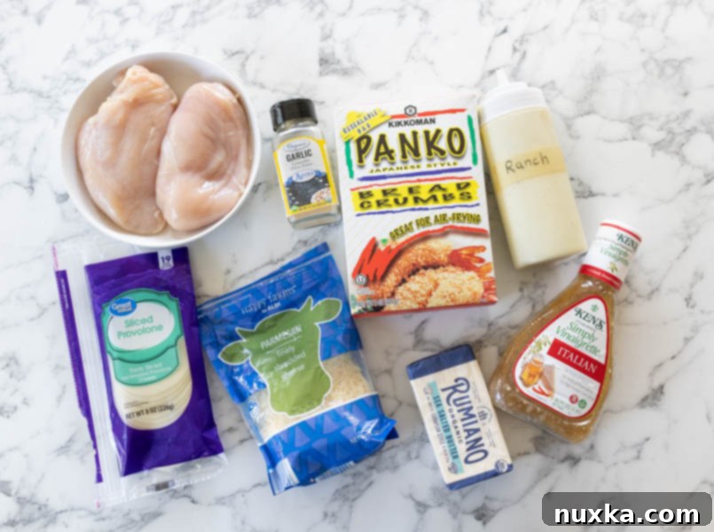 All ingredients for Longhorn Parmesan crusted chicken (chicken breasts, Panko bread crumbs, Shredded parmesan cheese, provolone cheese, garlic powder, creamy ranch dressing, Italian dressing, and salted butter). 