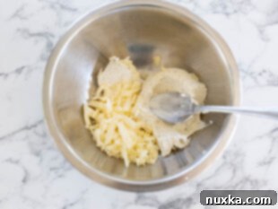 Making the garlic herb cream cheese filling for longhorn stuffed mushrooms
