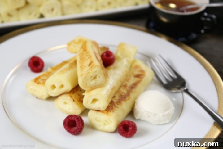 fluffy crepes-nalisniki-cottage cheese, a stack of golden brown, delicate crepes