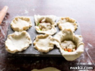 how to fill each crust with chicken, peas, carrots, with soup and seal with the top crust