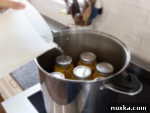 jars of peaches ready for water bath canning process