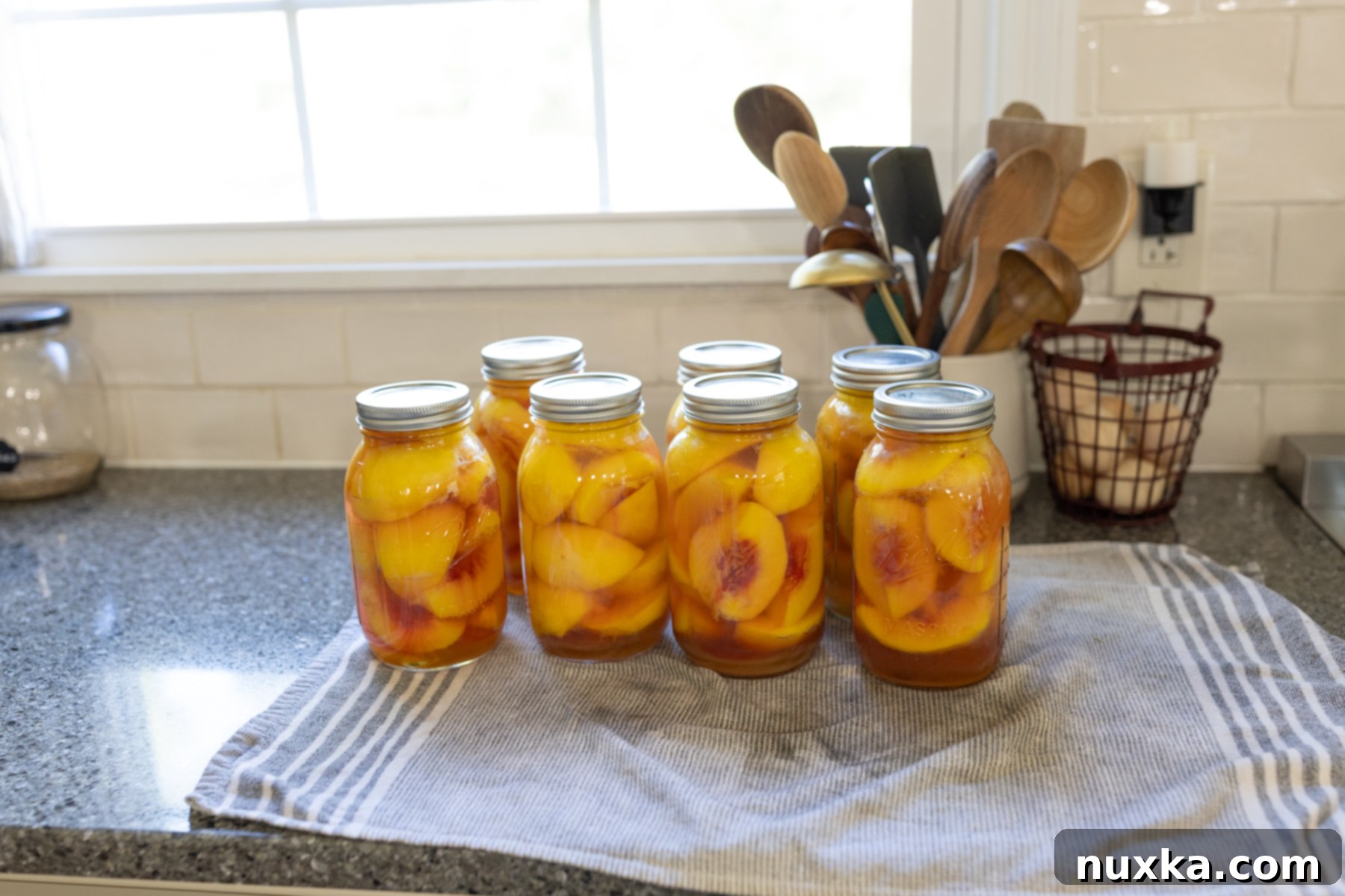 bushels of fresh, ripe peaches waiting to be canned