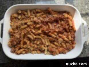 pizza casserole in a baking dish before the toppings