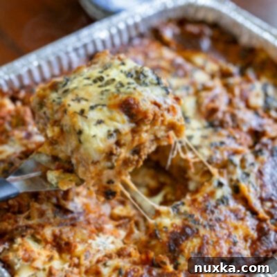 The Ultimate Freezer Lasagna 12 image of baked homemade freezer lasagna in a foil disposable pan