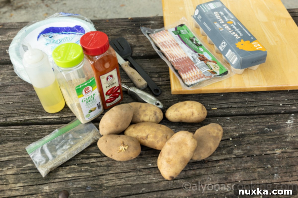 All ingredients for campfire breakfast potatoes (russet potatoes, garlic salt, paprika, black pepper, cooking oil). Bacon and eggs are optional