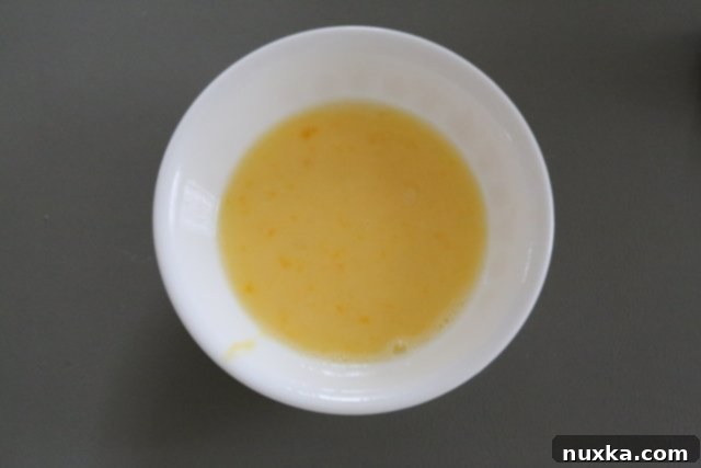 Egg wash mixture for cheese Danish, showing whisked egg, egg white, and water