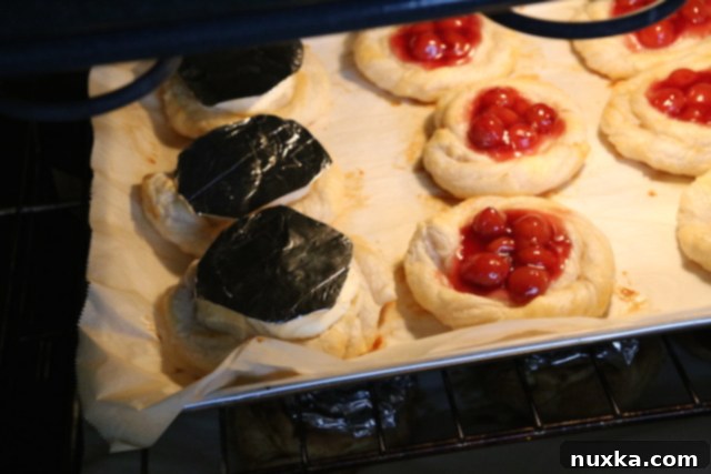 Baking Cheese Danishes in the oven with a little pouch of foil to prevent the filling from browning