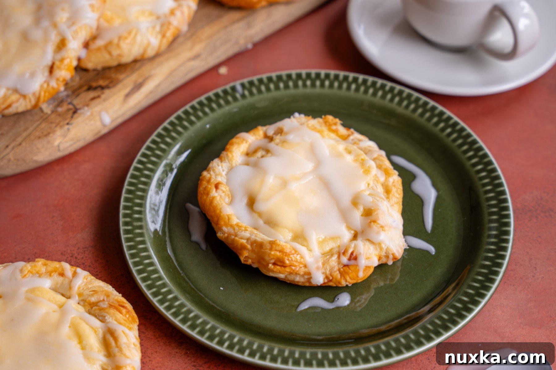 Close-up of a golden-baked Cream cheese Danish on a baking sheet