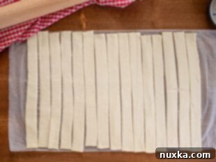 Puff pastry dough cut into strips for forming "nests"