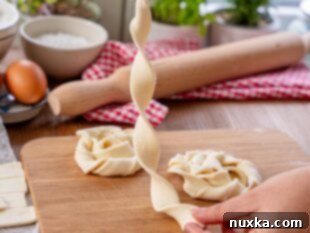 Twisting a single strip of puff pastry into a spiral