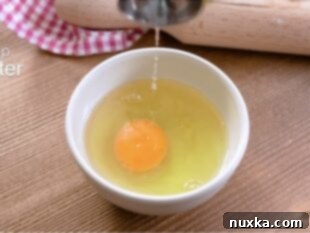 Egg wash in a bowl for cheese Danishes