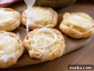 Drizzled cream cheese Danishes with white glaze