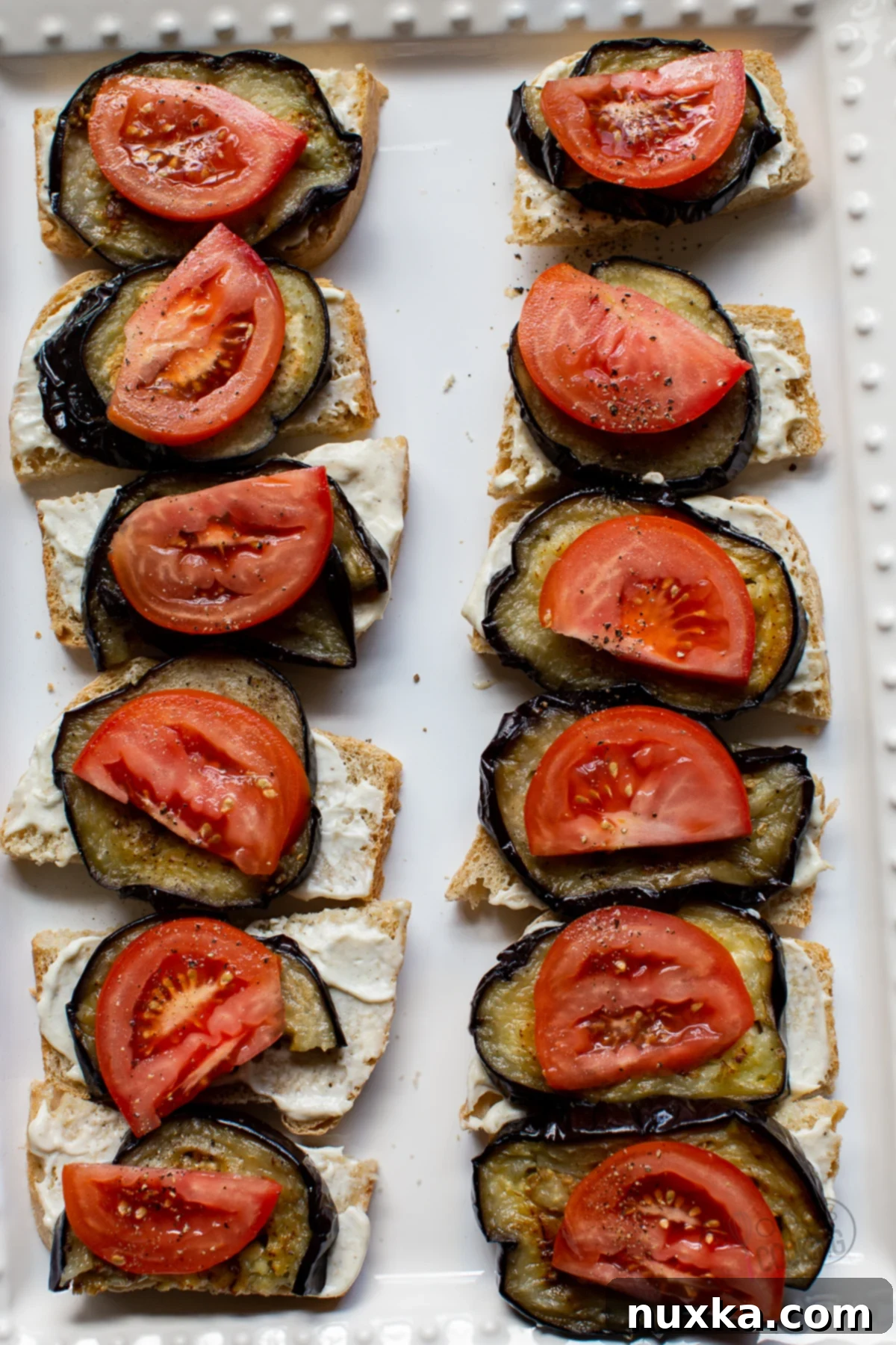Delicious roasted eggplant sandwich with fresh tomato and garlic aioli