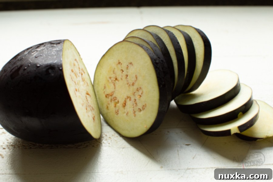 Closeup of perfectly sliced eggplant for roasting