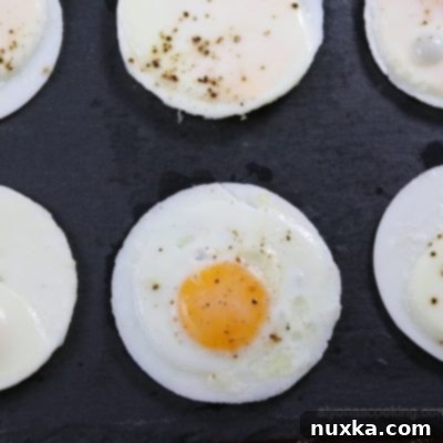 Delicious baked egg patties in a muffin tin, ready for breakfast sandwiches