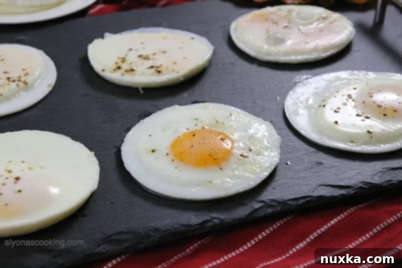 Stacked baked egg patties, showcasing their perfect round shape and uniform appearance