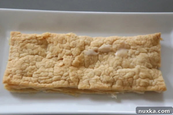Layering Pastry and Frosting for Napoleon Cake