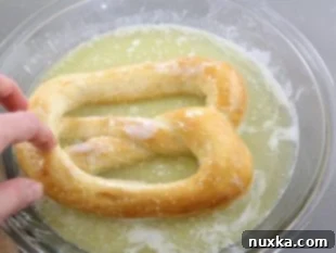 Freshly baked soft pretzels dipped in butter