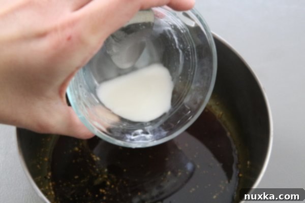 thickening teriyaki glaze in a saucepan