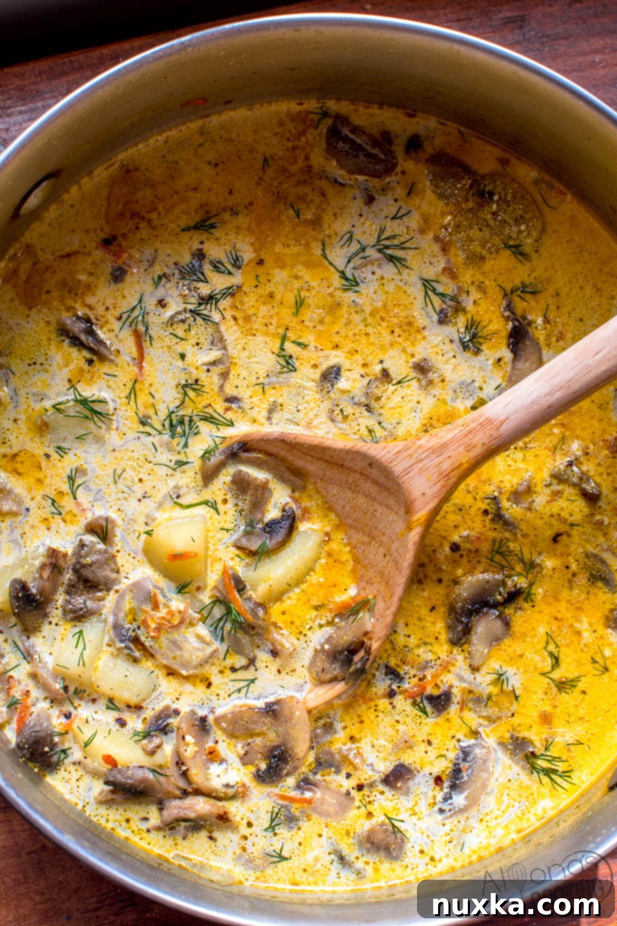 a pot of warm comforting mushroom soup #recipe the best mushroom soup recipe with cream