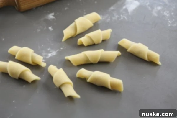 Close-up of shaped Nutella Rugelach on a baking sheet, ready for the oven