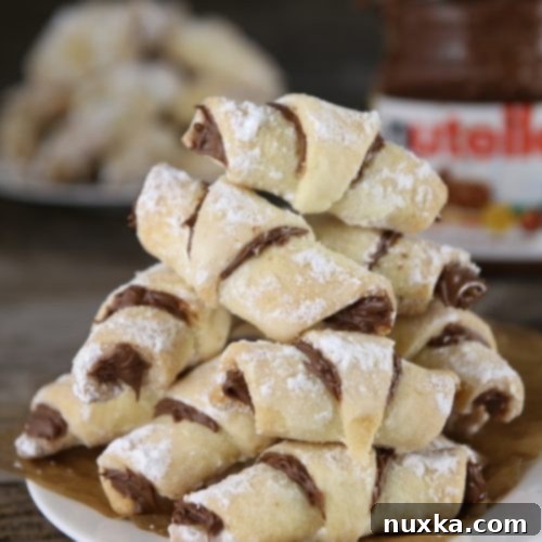 Decadent Nutella Russian Rugelach 19 Nutella Rogaliki (Russian Rugelach) on a plate