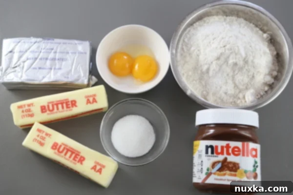 Ingredients for Nutella Rogaliki dough: butter, flour, cream cheese, egg yolks, sugar