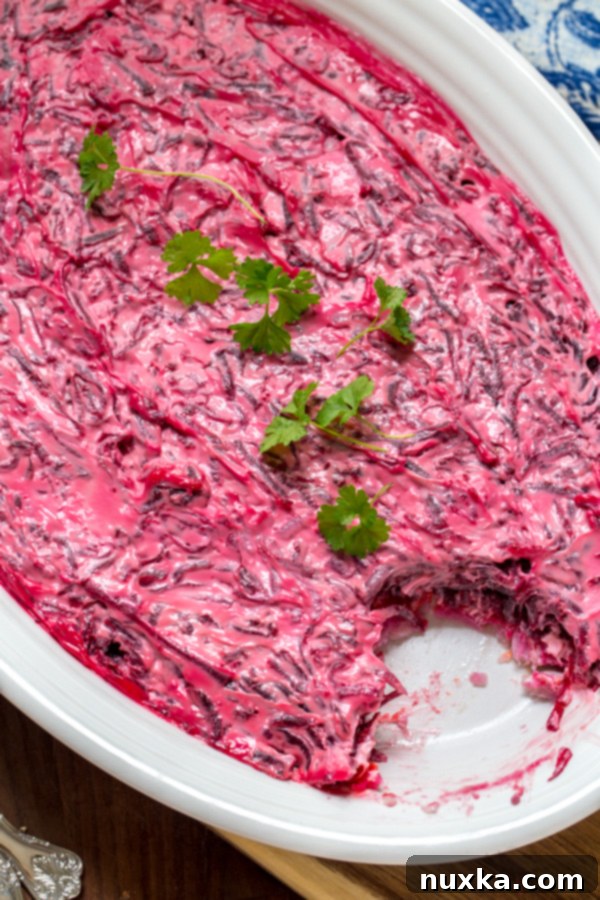dressed herring salad called shuba or herring under a fur coat layered with beets and mayo