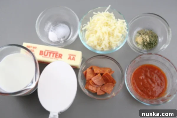ingredients for homemade hot pockets include, chopped pepperoni, pizza sauce, seasoning, Mozzarella cheese, flour, butter, and milk.