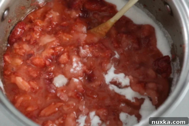 strawberry jam reaching a rolling boil