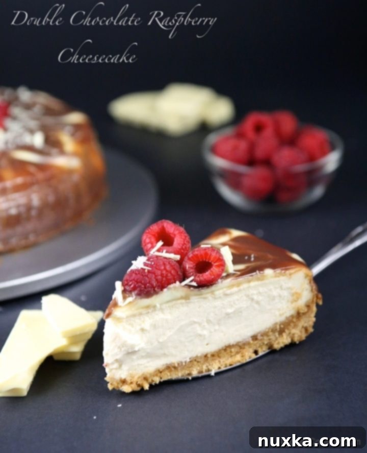 Double Chocolate Raspberry Cheesecake topped with fresh raspberries and ganache