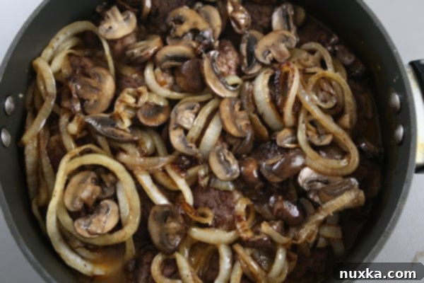 Salisbury Steak with Mushroom Gravy Step 6: Simmering Steaks in Gravy
