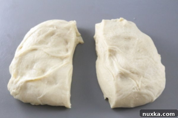 Dough divided in half for two poppy seed rolls