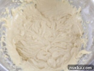 Russian honey cake batter beaten from eggs, honey, flour, baking soda, and vinegar