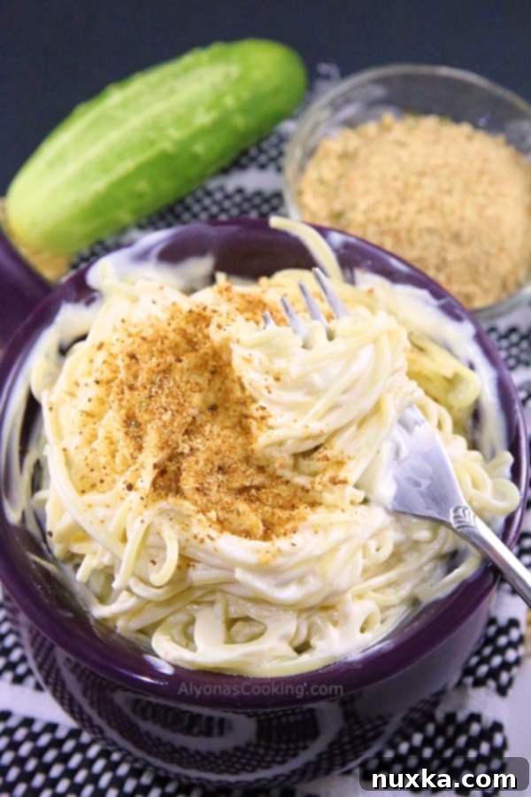 Creamy Angel Hair Pasta ready to be served, showcasing the rich cream cheese sauce