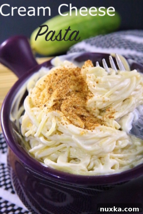 Close-up of Cream Cheese Pasta garnished with breadcrumbs, highlighting the creamy texture