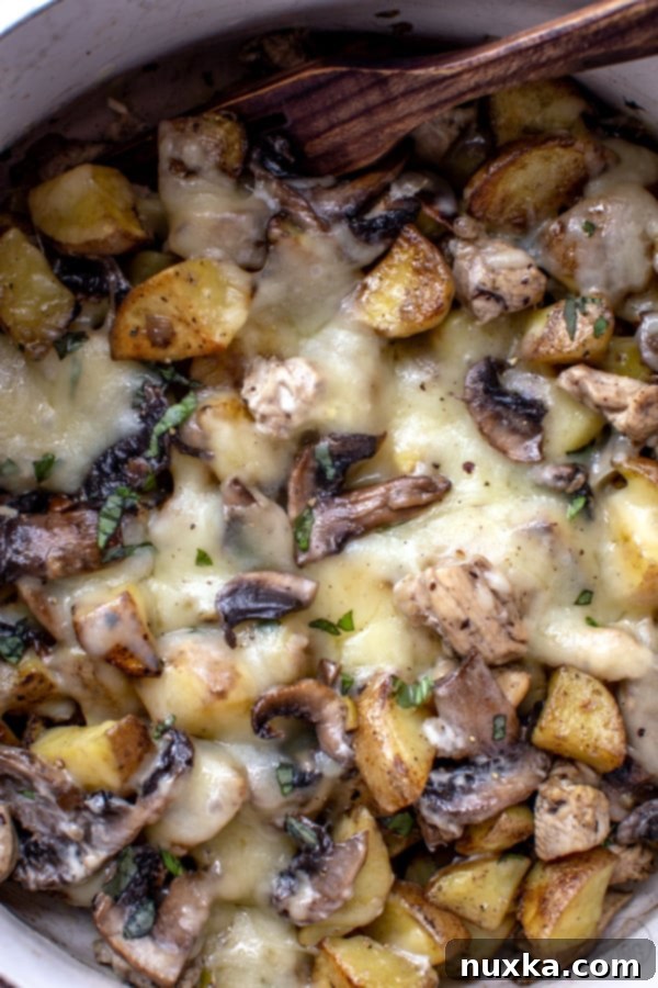 loaded potatoes with mushrooms, chicken and onion baked
