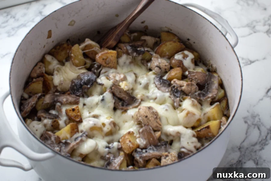 baked loaded mushroom and chicken potato casserole in with pot