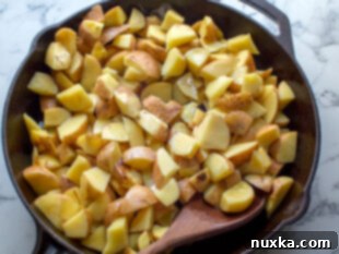 seared potatoes with skins on before they are baked
