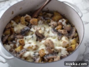 baked loaded mushroom and chicken potato casserole in with pot